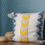 Blue and yellow striped pillow on a hotel table